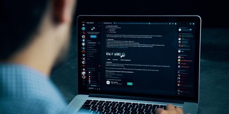 Photo Showing a Person Using Discord