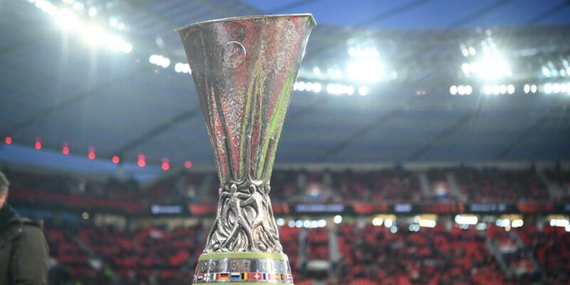 Close up of the UEFA Europa League trophy inside a stadium.
